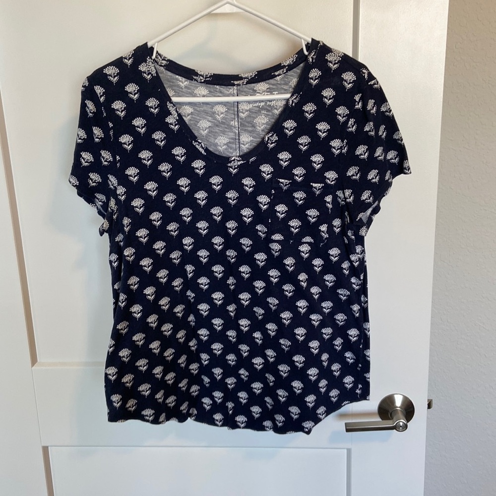 Navy and blue tee from Loft. Has a floral print and picked on the left.